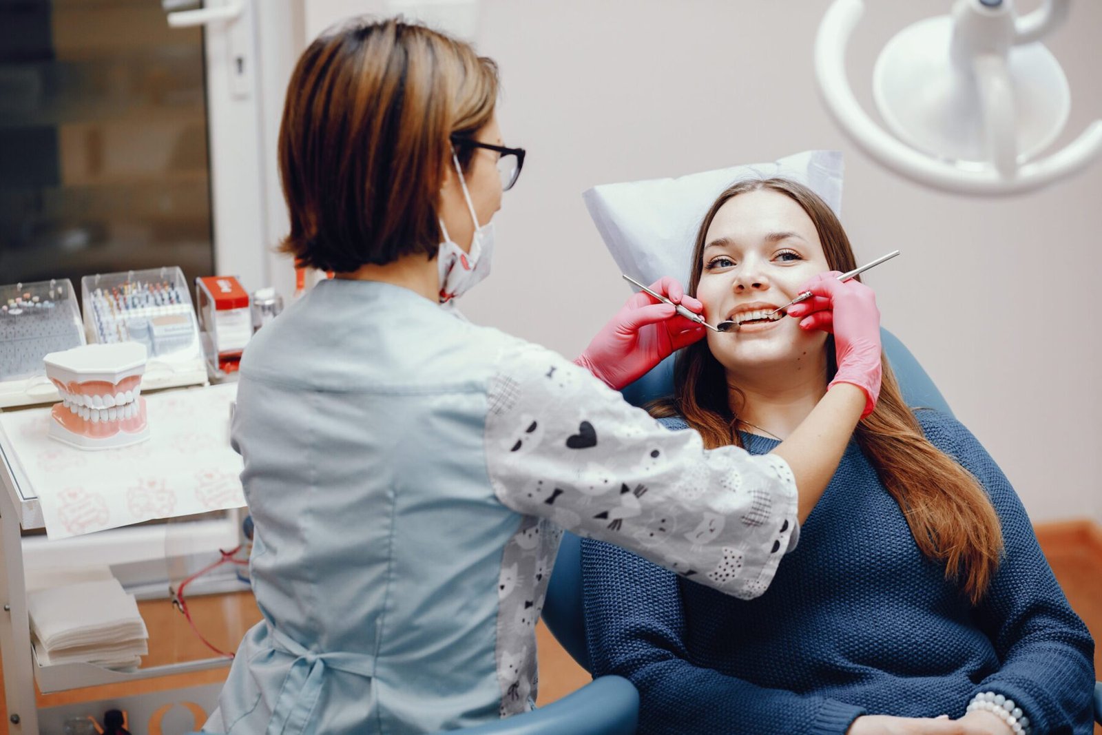 Beautiful girl sitting in the dentist's office